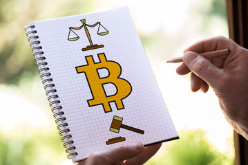 Bitcoin regulation concept on a notepad