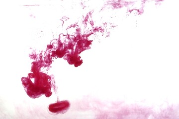 Red color dye melt on white background,Abstract smoke pattern,Colored liquid dye,Splash paint