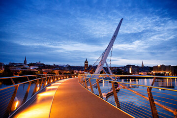 Derry, Ireland. Illuminated Peace bridge in Derry Londonderry, City of Culture, in Northern Ireland...