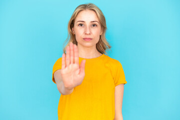 Obraz premium Woman saying no, showing stop gesture by hand