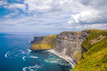 Spectacular Cliffs of Moher are sea cliffs located at the southwestern edge of the Burren region in...