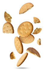Tasty dry crackers falling on white background