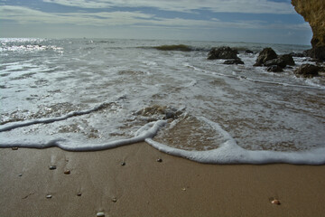 Photo of the tide moving on a sandy beach in Portugal