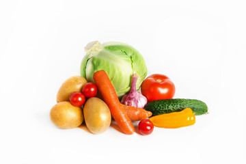 Fresh, healthy vegetables laid out in a triangle on a white isolated background. Harvesting. Healthy food. Isolated