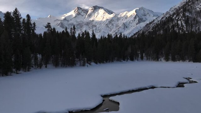 Snowy Nanga Parbat at Winter sunrise, View from Twisted Meadows. Aerial Drone Shot in Pakistan, Mount Killer at Dawn