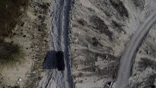 Aerial View Of an Off-road Vehicle On a Mountain Road 4K