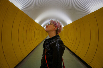 Portrait of a woman standing in a tunnel