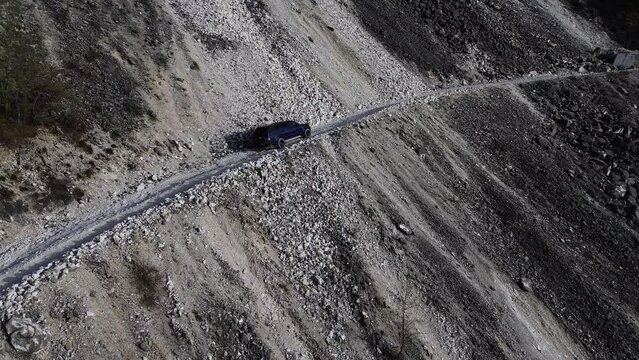 Aerial View Of an Off-road Vehicle On a Mountain Road 4K