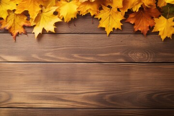 Naklejka na ściany i meble Vibrant autumn maple leaves in shades of orange and yellow arranged on a rustic wooden plank background. Autumn Leaves on Wooden Background