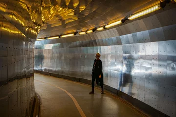 Möbelaufkleber A woman standing in a tunnel © niklas storm