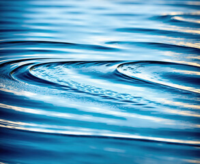 A photograph of a body of water with ripples in it.