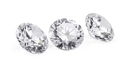 Fotobehang Three beautiful shiny diamonds isolated on white © New Africa