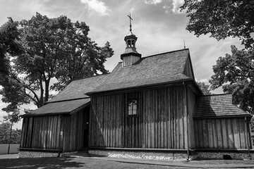 The wooden, historic parish church of St. Giles in the village of Zrebice - obrazy, fototapety, plakaty
