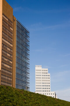 Highlighting modern skyscrapers against a bright blue sky, this image evokes progress, innovation, and the human pursuit towards the future