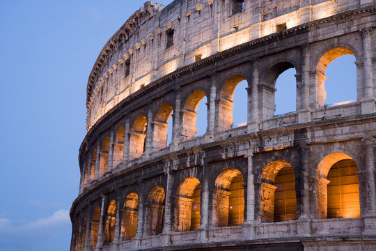 The Colosseum basked in golden sunset light, evoking the grandeur of ancient Rome and the enduring legacy of human civilization