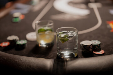 Drinks on a poker game table in late night