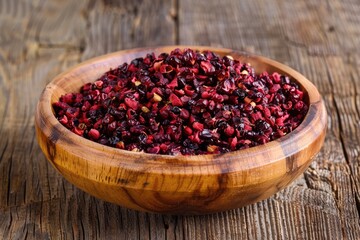 Healthy and Organic Barberries in Wooden Bowl on Rustic Table. Pile of Dried Barberries, a Favorful Herbal Ingredient for a Healthier Diet