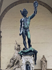 Bronze statue of Perseus holding the head of Medusa in Florence, Piazza della Signoria square, made...