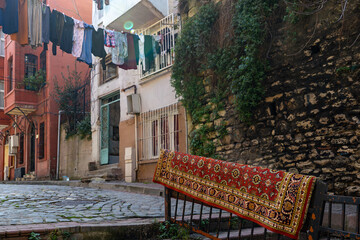Istanbul, Turkey A rug and laundry hang in the streets in the Balat district.