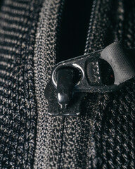 zipper on black leather background