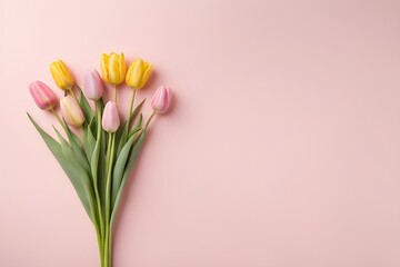 A pastel bouquet of fresh pink and yellow tulips. copy space soft pink background, perfect for spring, celebrations or romantic concepts. generative ai