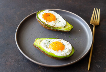 Avocado baked with egg. Healthy eating. Diet.