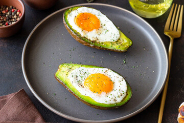 Avocado baked with egg. Healthy eating. Diet.