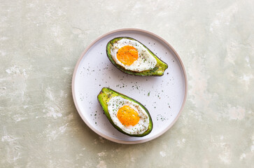 Avocado baked with egg. Healthy eating. Diet.