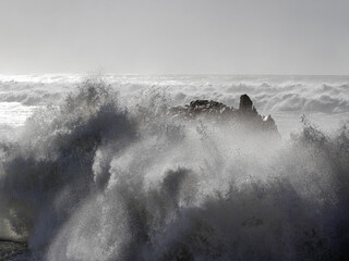 Cliffs being hit by strong stormy sea waves - 783062529