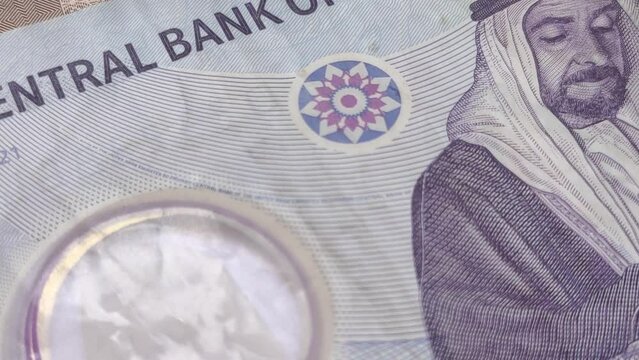 United Arab Emirates dirham (AED) national central bank currency note extreme closeup macro top view. UAE recession, inflation, economy, international money, investment, loan and reserve cash concept.