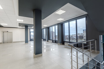 panorama view in empty modern hall with columns, doors, stairs and panoramic windows - 783063333