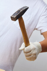 man in gloves with hammer