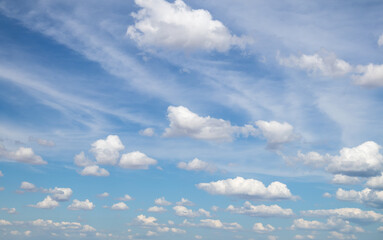Sky replacement blue sky with high puffy white clouds