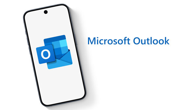 Outlook Logo is displayed on a modern smartphone, laying on a white underground with Microsoft Outlook lettering, email client, with functions as calendaring, task managing, contact managing, notes