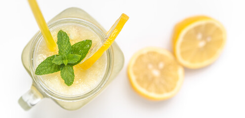 Fresh lemonade in glass jar with straw. Refreshing lemon drink isolated on white background. - 783081524
