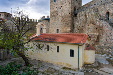 The Heptapyrgion or Yedikule (Seven Towers), a former fortress, later a prison and now a museum in Thessaloniki, Greece. View of the church of the prison and part of the walls. - 783081799