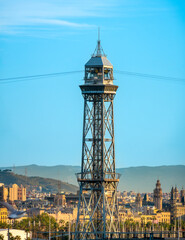 Fototapeta na wymiar Port Vell Aerial Tramway tower prominent in the skyline of central Barcelona, Catalonia, Spain