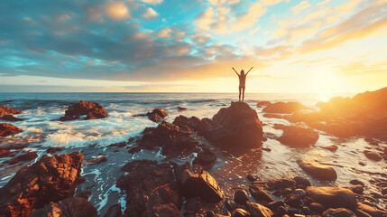a rocky beach background at sunrise. A woman stands atop rocks facing the sea with arms raised as if enjoying nature's beauty and inspiration. The overall feel should be uplifting and positive.  - Powered by Adobe