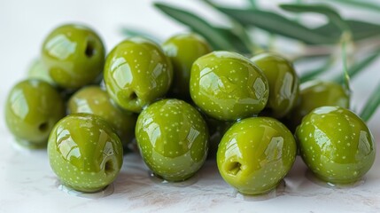 Green olives with leaves isolated on a white background with full depth of field. - obrazy, fototapety, plakaty