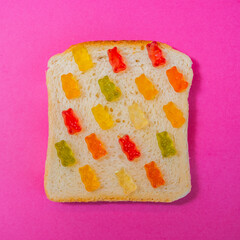 Multicolored marmalade on a slice of bread as a sandwich - 783101167