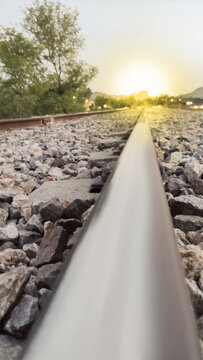 rail road in the mountains with sunlight from other side