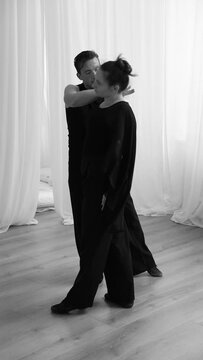 Couple dancing zouk. Dynamic black and white photography of dancing people.