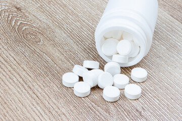 Oral medicine, paracetamol,white pills on blue background