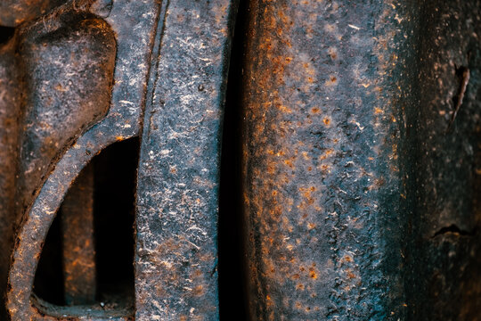 Close view of very old railroad wheel with heavy corrosion