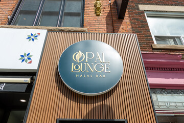 Fototapeta premium exterior round sign of Opal Lounge, a hookah bar, located at 124 Danforth Avenue in Toronto, Canada