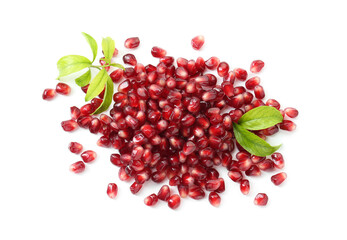 Pile of tasty pomegranate grains and leaves isolated on white