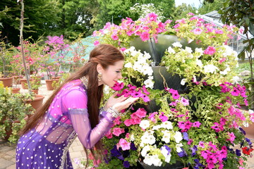 Beautiful colorful bollywood woman with colorful costume portrait at outdoor park. 