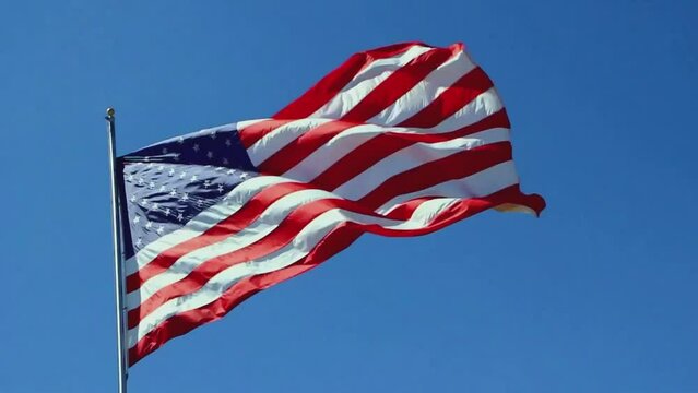American flag flying in the wind on July 4 in slow motion