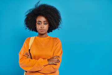 A stylish African American woman with a voluminous afro stands confidently in front of a vibrant...