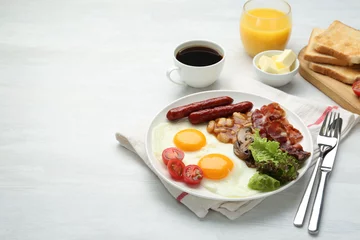 Fotobehang Delicious breakfast with sunny side up eggs served on white table. Space for text © New Africa